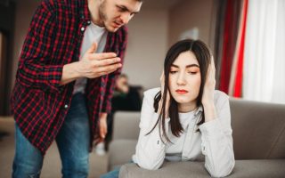 A man berating his girlfriend