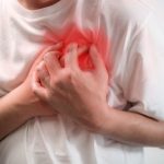Heart attack concept. Man suffering from chest pain on white background, Health care
