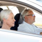 Two seniors in a car
