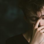 A young man looking tired and depressed