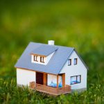 A model house in the grass