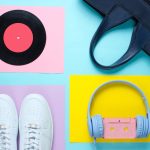 A vinyl record, pair of shoes, and headphones
