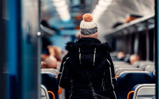 A woman walking on a train