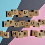 Gender pronouns written out in wooden blocks