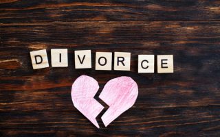 A ripped paper heart with the word "divorce" written out in blocks