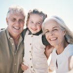 grandparents take selfie with little girl
