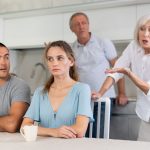 older couple arguing with younger couple