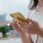 Woman use of mobile phone at outdoor