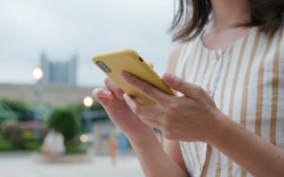 Woman use of mobile phone at outdoor