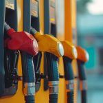 pump handles at a gas station