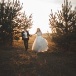 Young married couple walking in a forest