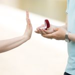 woman rejecting an engagement ring