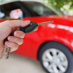 car keys and red car