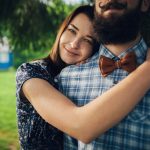 smiling woman hugging her boyfriend