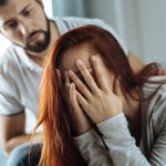 Unhappy cheerless woman being in despair
