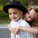 young happy boy and girl together outdoors