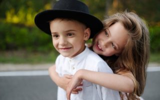 young happy boy and girl together outdoors