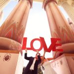 Bride and groom having fun near a big building