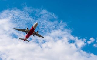 An airplane belonging to one of the top airlines flying in the sky