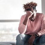 A young person going through mental health problems and feeling distressedd