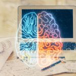 A laptop computer with a graphic of a brain in front of it