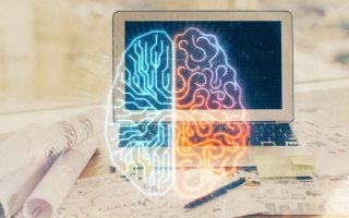 A laptop computer with a graphic of a brain in front of it