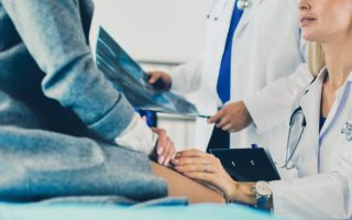 Doctor and patient discussing scan results in diagnostic center