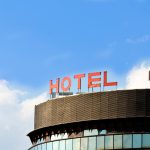 A hotel sign on top of a building