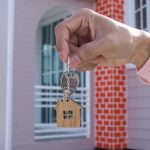 Landlord handing over the house key for new home