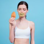 Skinny girl holding chicken with 