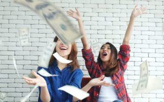 A couple of friends who are throwing money around and having conversations about cash