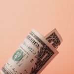 A rolled up $1 bill