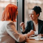 A woman hiring her friend to work at her business
