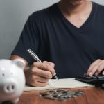 Someone making a budgeting and saving money