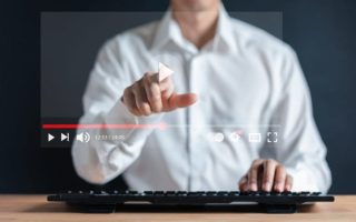 Man watching a video on a website