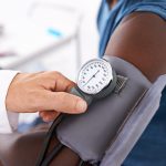 A man getting his blood pressure tested