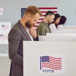 An American male in a voting booth