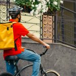 A gig economy bike rider on the road