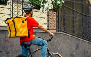 A gig economy bike rider on the road