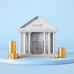 A model bank with cold coins stacked on either side