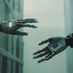 Two robotic hands reaching towards each other in a futuristic setting like one seen in a sci-fi movie