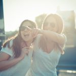 Two young female friends having a good time together