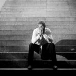 An exhausted businessman looking sad