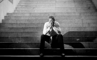 An exhausted businessman looking sad