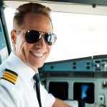 Pilot looking happy in a cockpit