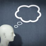 A thought bubble above the model of a head, indicating a voice in your head