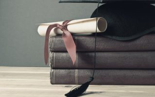 Graduation cap on a pile of books