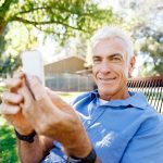 A senior citizen using a smartphone