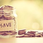 Coins in glass jar for saving