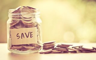 Coins in glass jar for saving